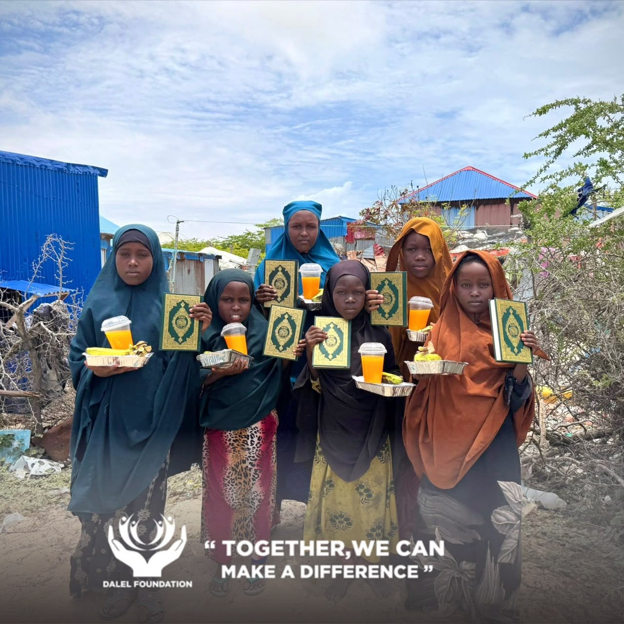 Six girls holding copies of the Qur'an together with trays of food and fresh juice